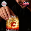 A detailed shot of a Calgary Flames whiskey glass in use showing ice and rich color tones!