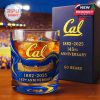 A commemorative Cal whiskey glass with 143rd anniversary branding, featuring the Cal logo, stadium design, and years 1882–2025 in gold on a rich blue background!