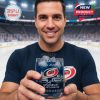Man at hockey arena holding out a Carolina Hurricanes whiskey glass featuring logo and 54th anniversary graphics!