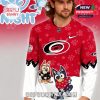 Side view of red hockey sweater with cartoon graphics!