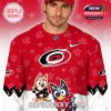Front view red hockey sweater with cartoon dogs!