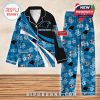 Carolina Panthers-themed pajamas in blue and black, decorated with team logos, tropical floral patterns, and custom name labels!