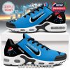 A top view of the Carolina Panthers sneakers showing the team logo with Santa hat at the toe and PANTHERSMAS text by the laces on a blue background!