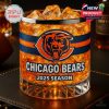 A glass designed for Chicago Bears fans, wrapped in orange and navy with the official logo and 2025 season print, glowing with chilled whiskey or soda and ice!