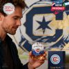 Chicago Fire FC whiskey glass featuring a logo and skyline design, held by a man.!