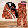 Orange and black Cincinnati Bengals pajamas with bold team branding, hibiscus flowers, and custom name features!
