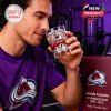 Man drinks from Avalanche anniversary glass in a casual gym setting with the product box beside him, showcasing team pride!