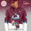 Man wearing a Bluey Night Colorado Avalanche hoodie with cartoon characters team logo and patterned background!