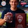 Man smiling while holding a Colorado Rapids whiskey glass with red drink and ice in a stadium environment!
