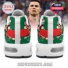 Back heels of CR7 sneakers showing cartoon Ronaldo celebrations on a red and green holiday backdrop!