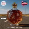 A whiskey bottle shaped like a D20 die with a crown on top placed on a road.