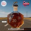 A whiskey bottle shaped like a D20 die with a unique top design placed on a road.