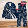 Navy blue Dallas Cowboys pajamas with white floral prints, bold team branding, and customizable fan name sections!
