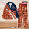 Orange and navy Denver Broncos pajamas with floral prints, football helmets, team branding, and custom name sections!