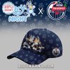 Navy cap with Bluey hockey characters and Edmonton Oilers logo, set against a patterned paw print background.