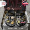 Elvis Presley-themed slippers with icons like guitars, crowns, and a microphone.