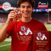 Smiling young man holding a Fresno State Bulldogs whiskey glass during a game at the stadium!