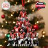 Georgia Bulldogs Christmas ornament featuring nine football players in red uniforms standing in a pyramid shape, with a championship trophy at the bottom and a red ribbon hanger, all on a Christmas tree!