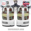 Feet wearing Ghost theme sneakers with band figure, bold maroon lines, and eerie mask design!