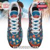 Bird’s-eye view of Home Alone themed shoes with detailed illustrations on the tongue and front panels.