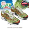 Top view of holiday-themed sneakers showing the Grinch with bold graffiti-style art and themed symbols across the front and tongue area!
