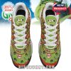 Left side view of colorful Grinch-themed sneakers with vivid artwork, graffiti warnings, and dynamic red-green patterns!