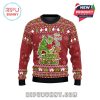 Front view of Grinch-themed red holiday sweater with central character illustration and holiday phrases.
