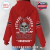 Woman modeling red Indiana Hoosiers hoodie from the back with skull helmet graphic and slogan!