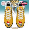 Overhead shot of yellow Jaguars sneakers with holiday logos on toe and tongue and white lace pattern!