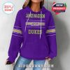 Woman modeling purple hoodie from the front with James Madison Dukes logo and sleeve detail!