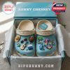 Tropical-themed Kenny Chesney Crocs with beach accessories like guitars, palm trees, and colorful floral charms.