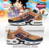 Full side angle view of Dragon Ball sneakers with Krillin print, pink striping, and anime motifs on an orange background!