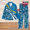 Blue Los Angeles Chargers pajama set with floral accents and team branding, laid out on a wood-textured background!