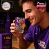 Focused moment of a fan appreciating his LSU Tigers drinkware, detailed with team colors, tiger logo, and championship recognition!