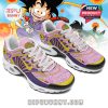 Anime-themed sneakers with Dragon Ball graphics in pink and yellow, featuring white laces, anime symbols, and a cartoon Shenron image on the tongue!