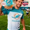 A man holds a Dolphins 60th Anniversary glass and wears a Dolphins t-shirt.!