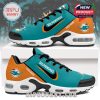 Side view of teal sneakers with Miami Dolphins graphics and personalized name option!