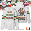 White hoodie with Miami Hurricanes logo on front and skull helmet graphic on back with the phrase