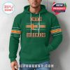 Man modeling green hoodie from the front with Miami Hurricanes logo and orange sleeve stripes!