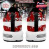 Rear view of red sneakers featuring Michael Jackson poses and a wide white accent strip!
