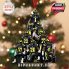 Pyramid football ornament with Michigan players in navy blue and yellow uniforms, wearing M helmets, ready to hang with red ribbon and completed by a championship trophy detail!