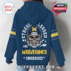 Woman modeling Michigan Wolverines hoodie from the back with skull helmet fan design and bold text!