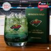 A collector's edition Minnesota Wild whiskey glass with deep green color and detailed etching commemorating the team's 29th anniversary!