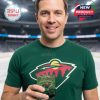 A fan matches his Minnesota Wild gear with the commemorative whiskey glass, enjoying the moment on the ice!