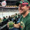 In the heart of the action, a fan pairs his team pride with the Minnesota Wild anniversary glass for a perfect game day moment!