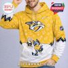 A yellow and white hoodie showing the Nashville Predators logo, Bluey cartoon characters in hockey outfits, and playful paw print graphics!