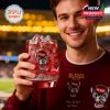 Smiling NC State Wolfpack fan holding a red whiskey glass with ice inside a football stadium!