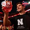 A fan lifts the Nebraska whiskey glass high at the stadium, celebrating 135 years with a stylish keepsake and elegant gift box!