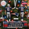 Christmas ornament of Maye and Brady holding hands, celebrating their New England Patriots legacy.