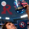 New England Revolution glass lifted at a stadium, emphasizing fan pride and style.